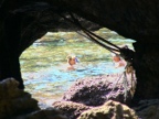 snorkelers through cave window